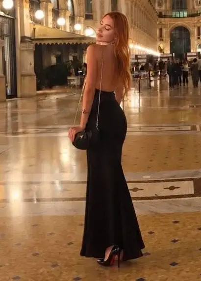 Woman in black dress at Galleria Vittorio Emanuele II.