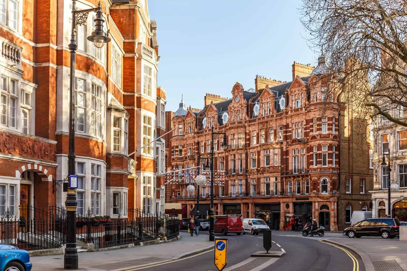 Historic London street with red brick buildings.