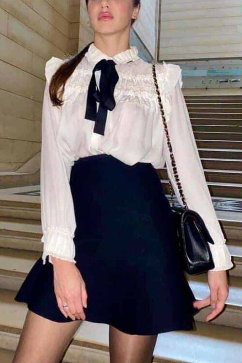 Woman in elegant outfit on staircase