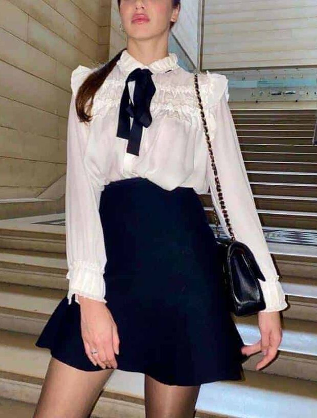 elite escort aprilina3 Woman in elegant outfit on staircase