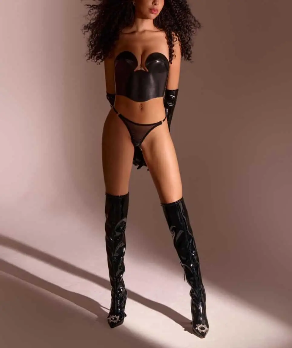 Woman wearing black lingerie and boots