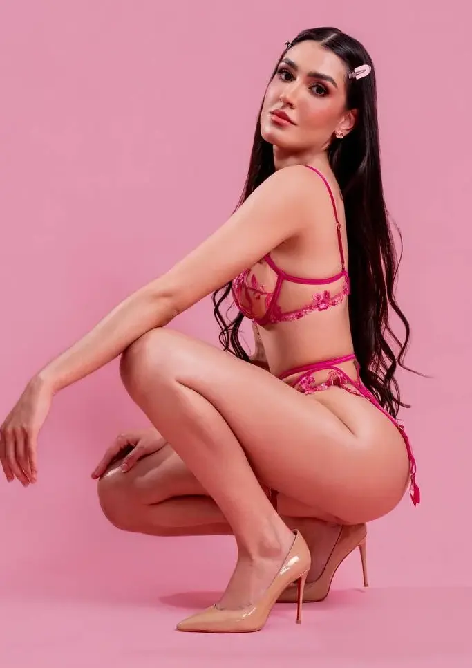 kiyara Model in pink floral embroidered lingerie set on pink background